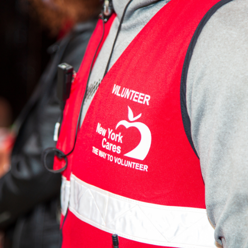 Closeup shot of New York Cares logo on volunteer vest