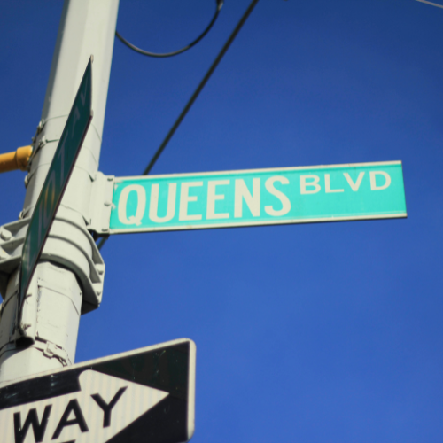 Close up shot of Queens Blvd street sign